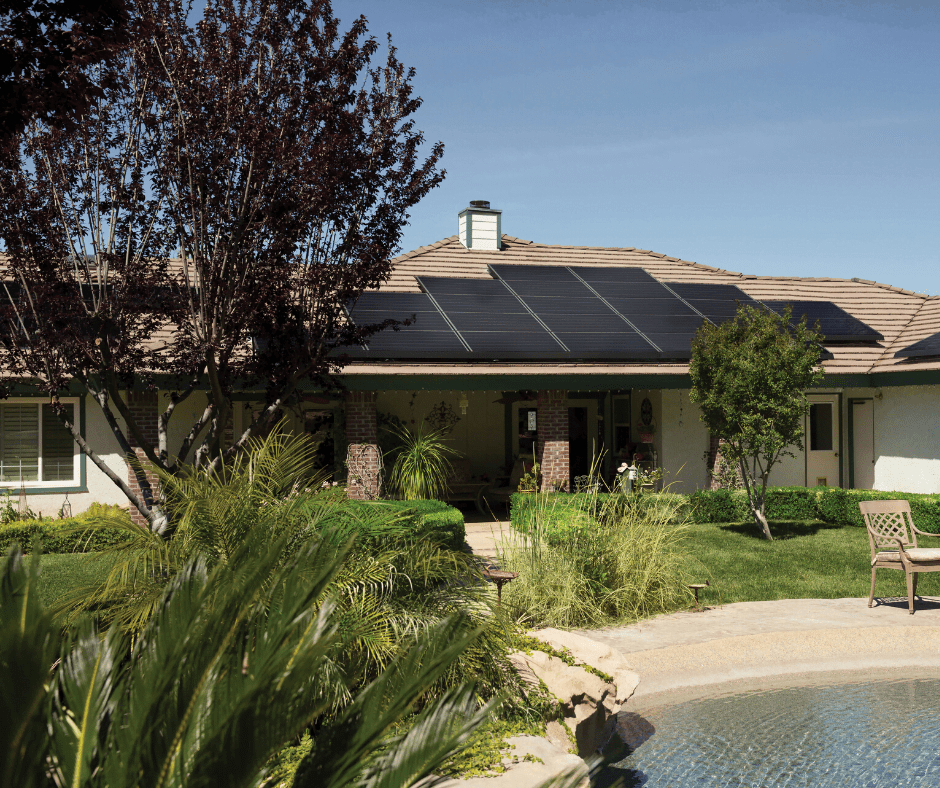Single family home with a pool and plants in their backyard, and solar panels on their roof in relation to Maryland's solar roof panel architectural laws.